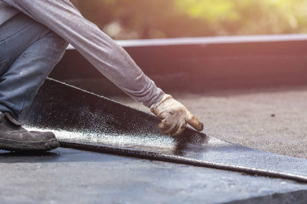 Professional Basement Waterproofing technician working in Haywood, VA